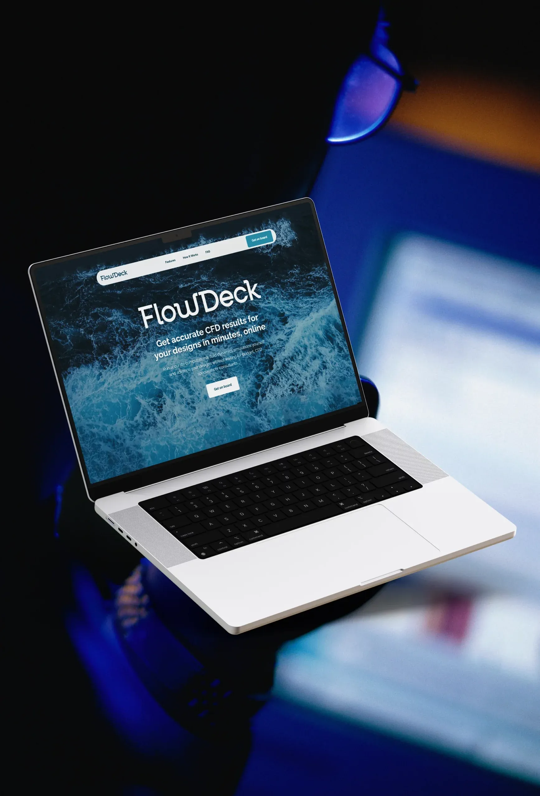 FlowDeck cloud CFD homepage on a MacBook Pro, promising accurate results online in minutes