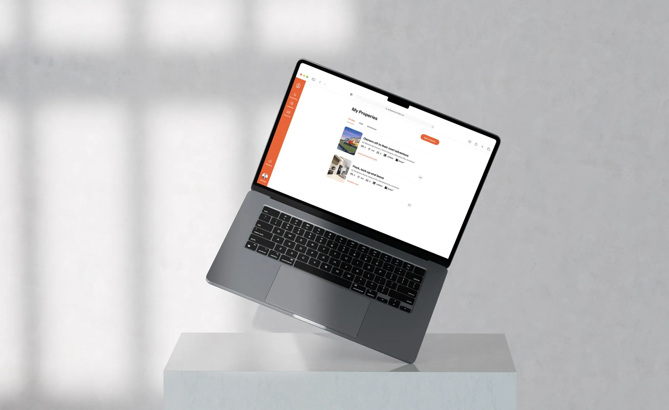 Property Writer AI My Properties dashboard listing real estate agent property records on a laptop