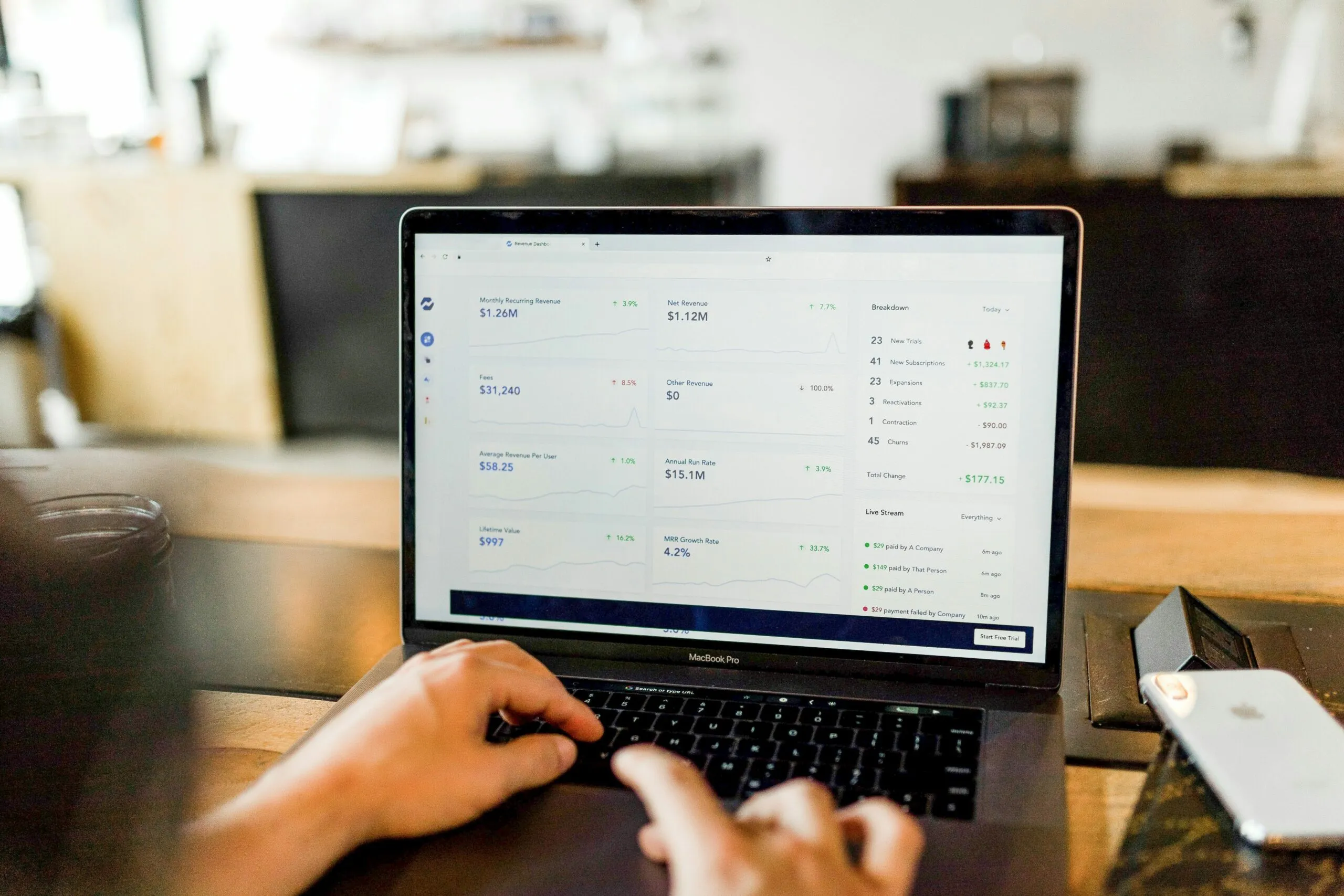 Person working at a laptop in a modern office environment, representing digital business transformation