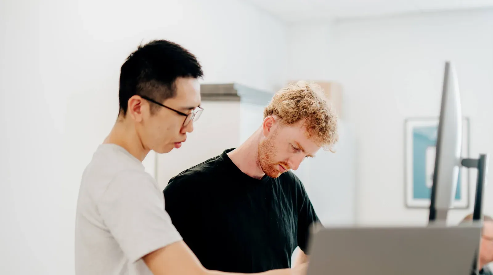 Two Putti developers reading through a codebase together