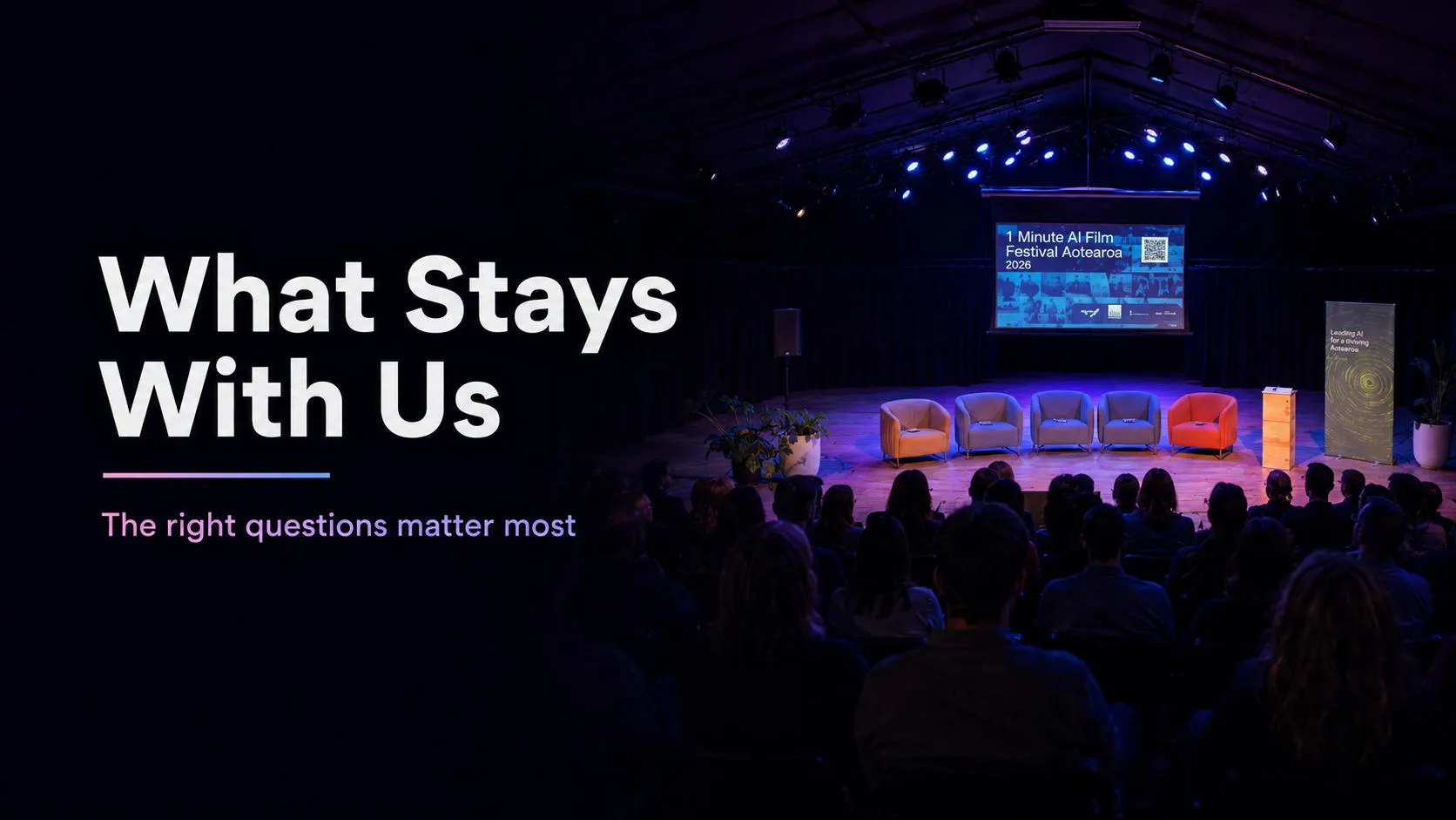 Summit stage with empty panel chairs and a 1 Minute AI Film Festival Aotearoa slide, facing a seated audience
