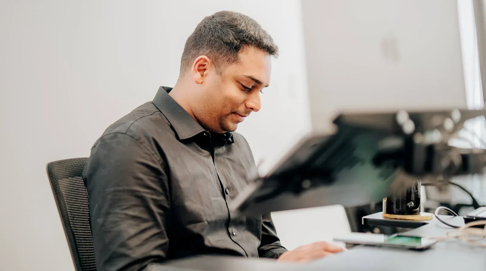 A Putti engineer reviewing a system at their desk in Auckland