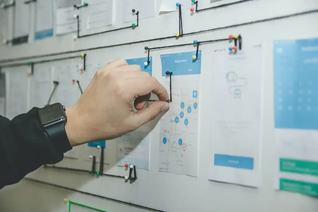Person reviewing automated workflow processes on a laptop in a modern office