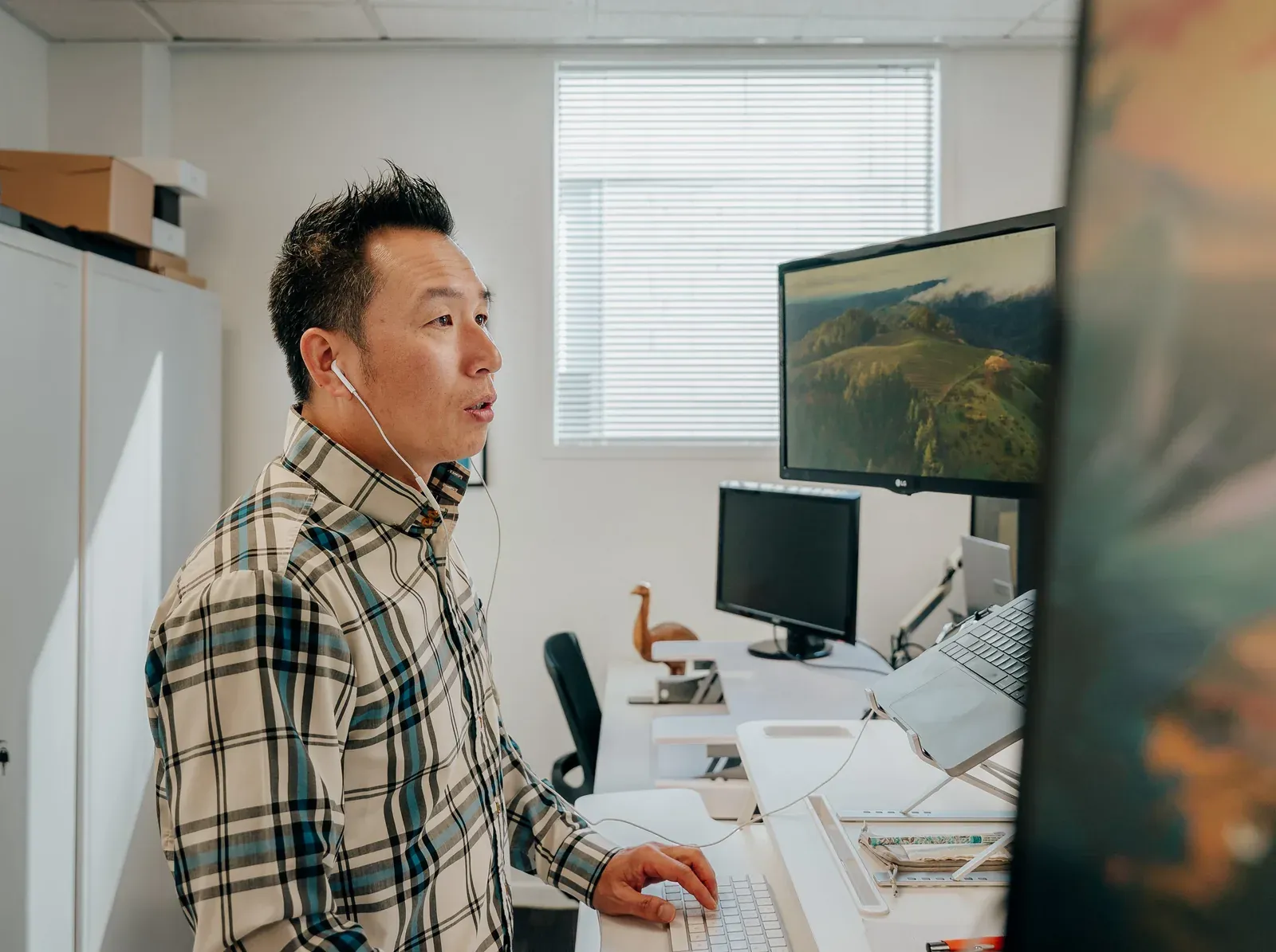 A Putti developer taking a support call at their desk in Auckland