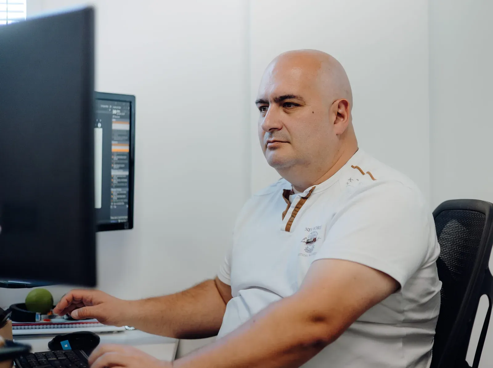 A Putti engineer maintaining a long running business system at their desk