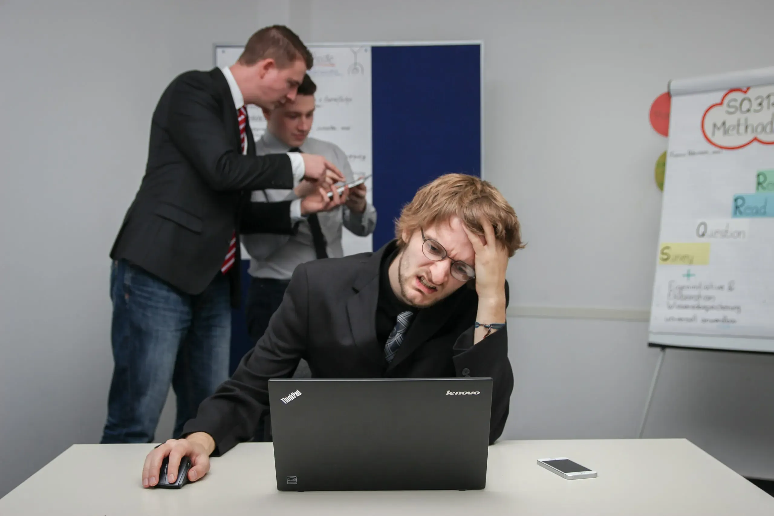 Developer reviewing a complex codebase to rescue a failing software project