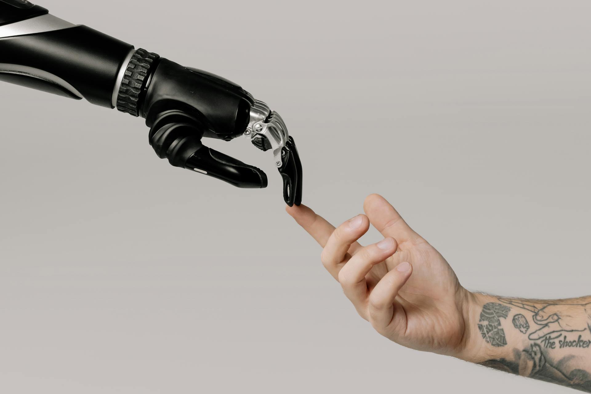 A Robot and human had touching each other
